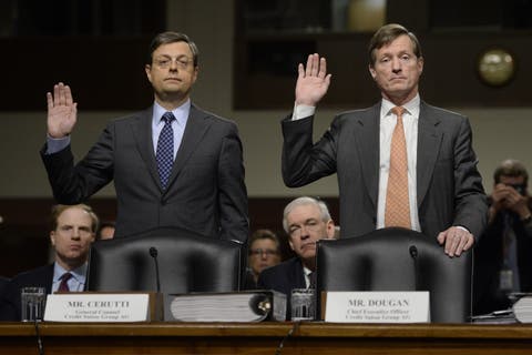 Chefjurist Romeo Cerutti (l.) and CS-CEO Brady Dougan müssen im Februar 2014 dem US-Senat Auskunft über das Geschäftsgebaren geben.