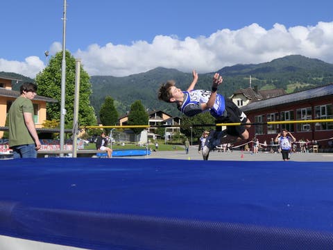 Jian Min Whelen does the high jump.