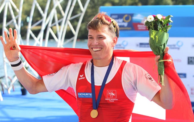 Andrey Strozhina celebrates the gold medal
